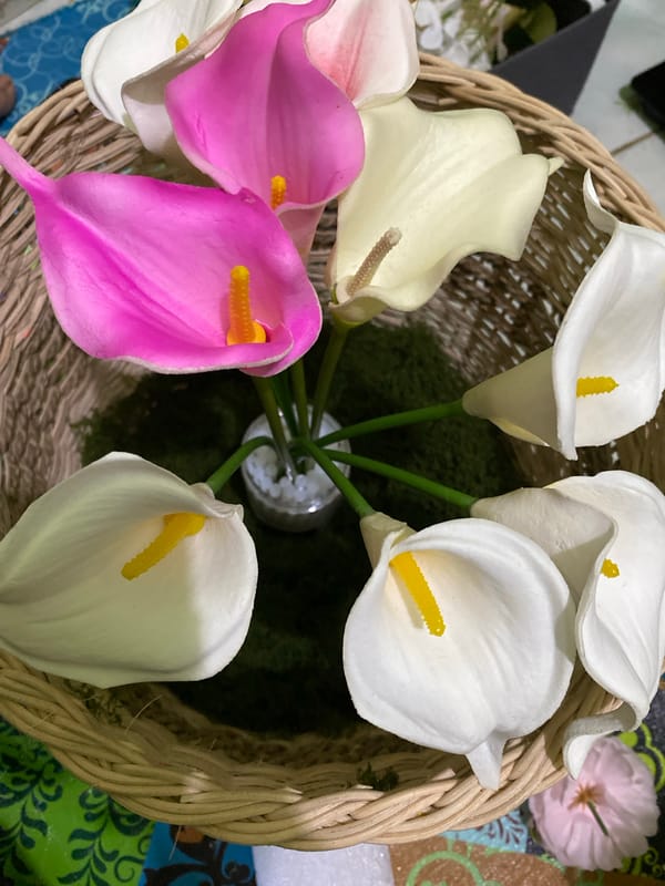 Artificial calla lily arrangement in a woven basket, Kuala Pembuang