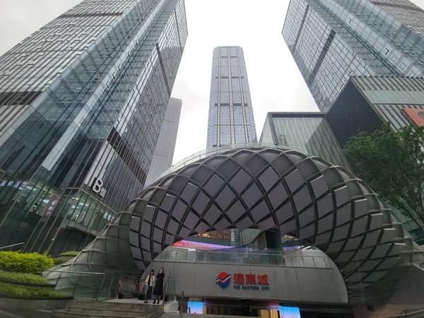 Rainy morning documented across modern Liangjiang commercial district