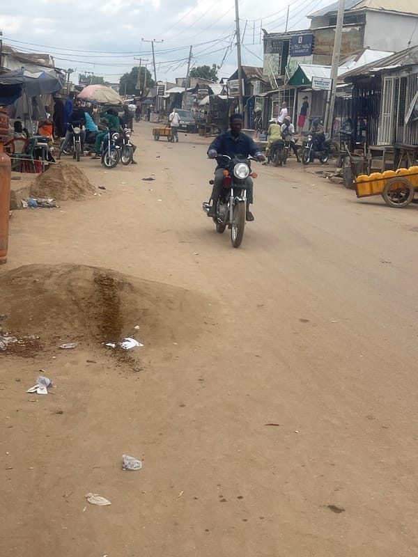 Busy street and shop scenes from an Abuja market area