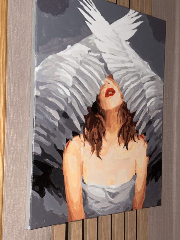 Artist's home showcases cat-themed artwork and gray feline companion