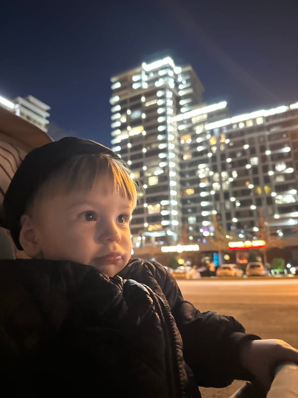 Child in hooded jacket spotted looking upward in Kazan