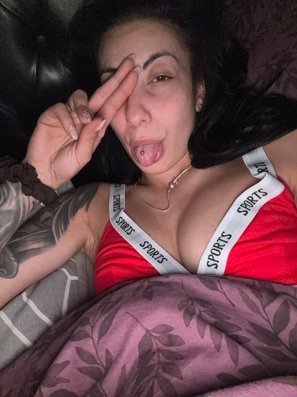 Woman rests indoors in sports attire in Warrington
