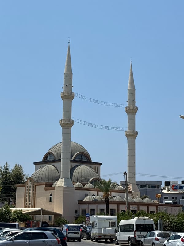 Mosque and colorful apartment buildings in Alanya, Turkey