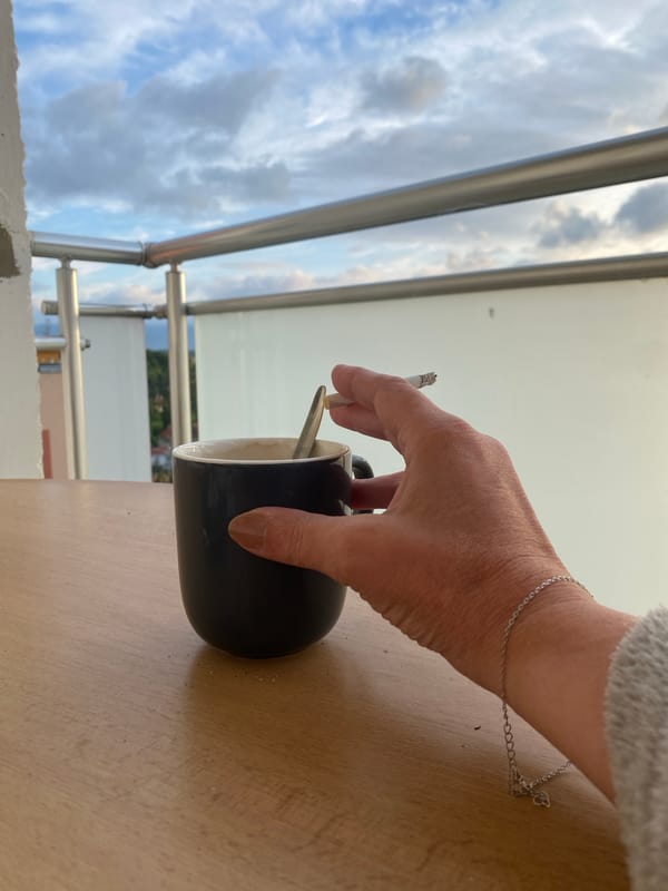 Coffee and cigarettes on a Bílina balcony at sunset