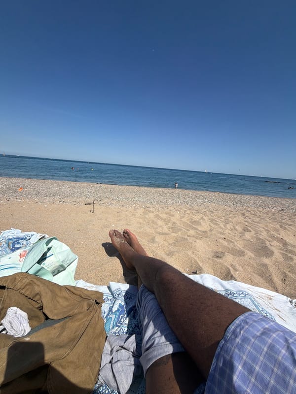 Beachgoer enjoys clear day at Sant Adrià de Besòs Mediterranean shore