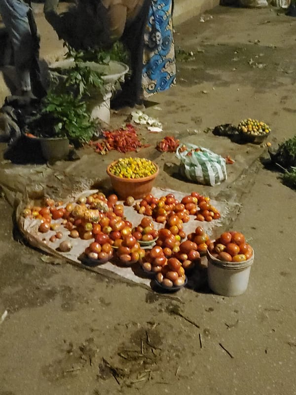 Bukuru's night market scene: grills, stalls, and street commerce