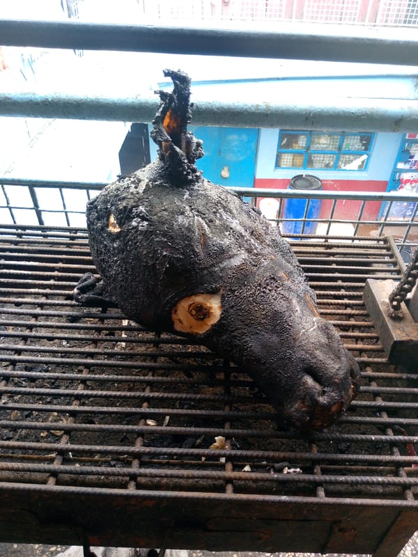 Morning street scenes in Nairobi: food preparation and motorcycle incident