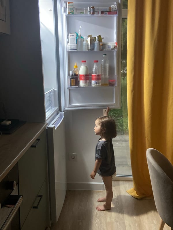 Child explores kitchen during rainy afternoon in Tyumen