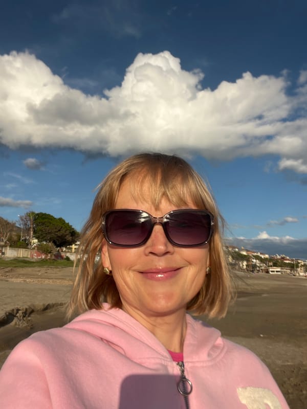 Woman takes beach selfies in Alanya, Turkey