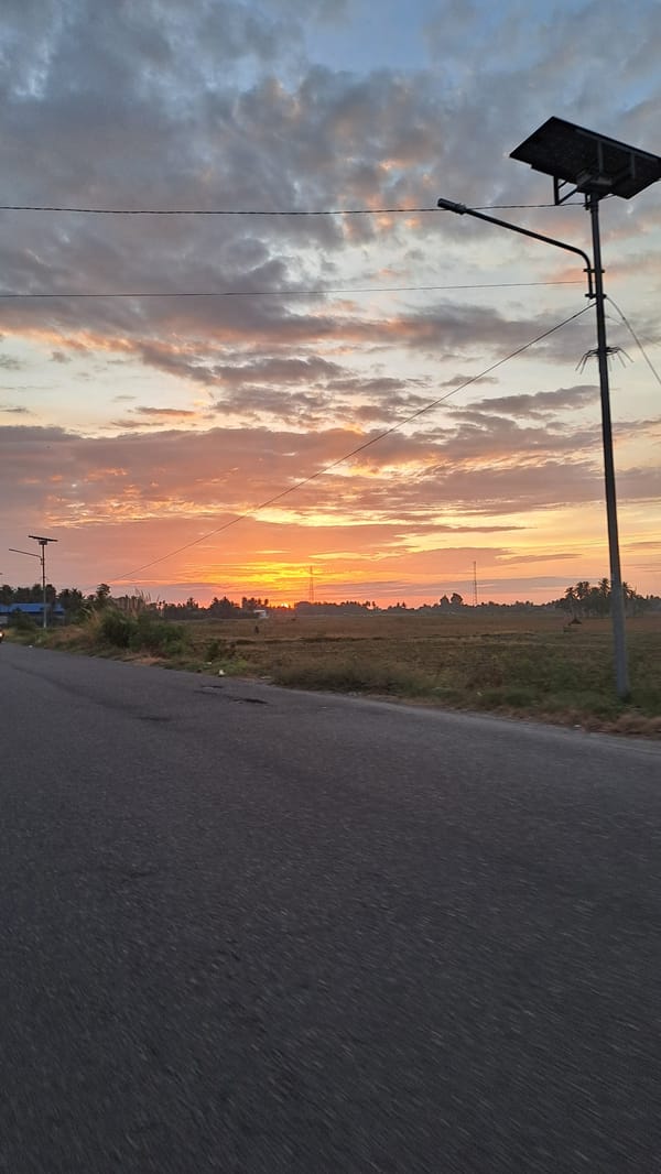 Vivid sunset colors over rural Cotgapu, Indonesia