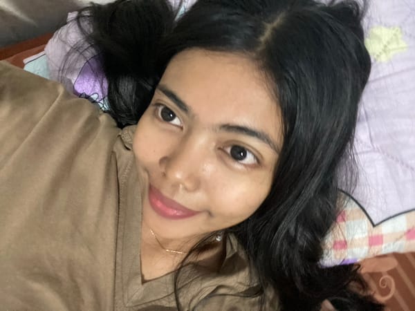 Relaxed bedroom selfie moment in Madiun, Indonesia