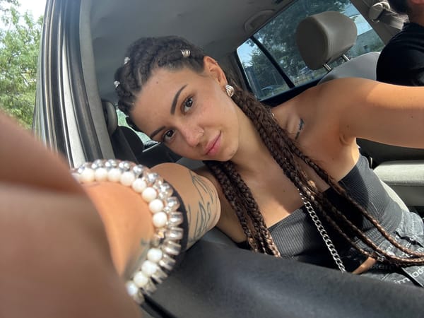 In-car portrait session with braids and silver jewelry, Sofia