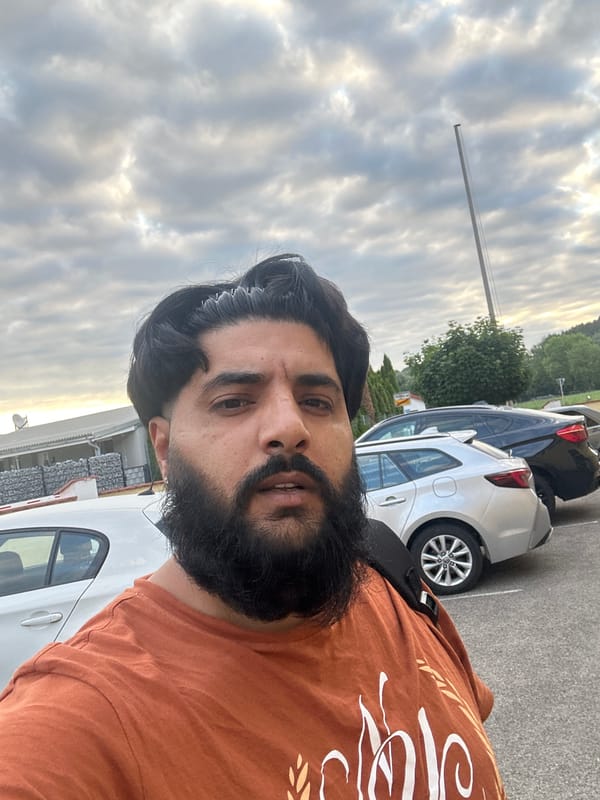 Outdoor selfie in a Mainburg parking lot, July 2026