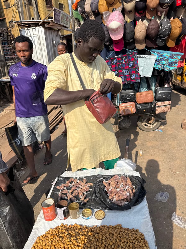 Street vendors conduct business in Nigerian marketplace