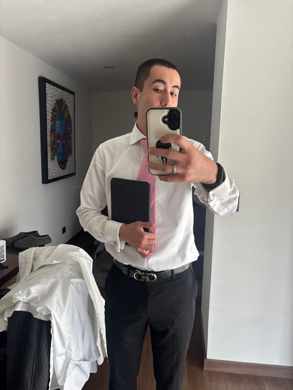 Person takes formal attire selfie in Mexican bathroom
