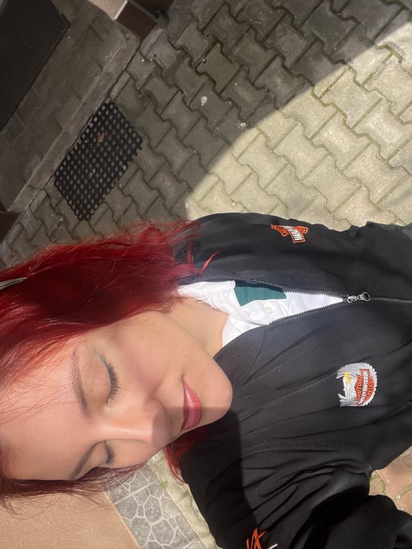 Woman conducts outdoor photo shoot on Asenovgrad sidewalk