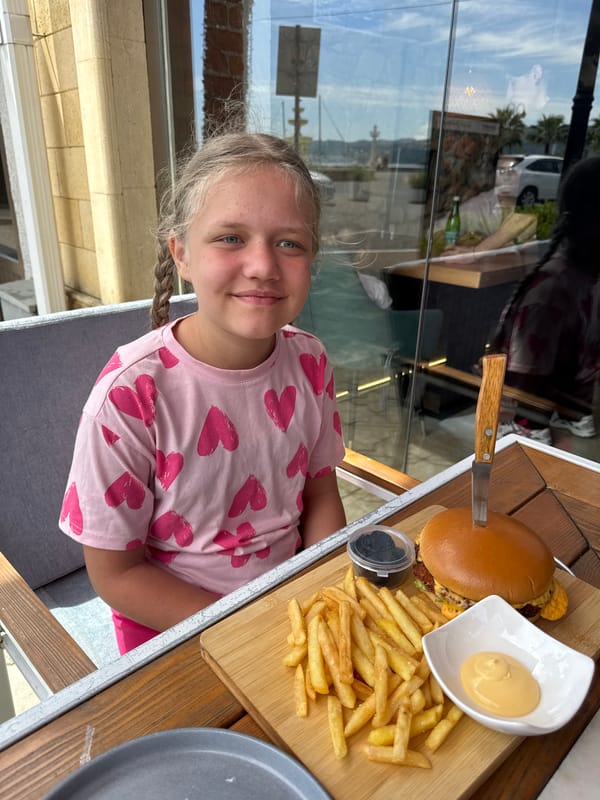 Young girl enjoys outdoor dining in Sokhumi, Abkhazia