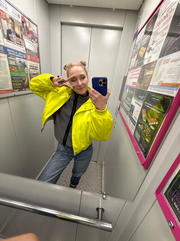 Woman takes mirror selfie in Perm elevator