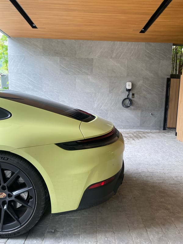 Yellow Porsche Taycan spotted charging at Choeng Thale residence