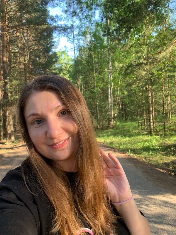 Woman enjoys afternoon picnic and forest walk in Chaikovsky
