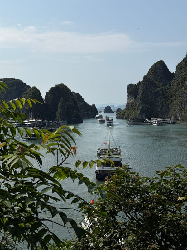 Tourists document Ha Long Bay scenery and cave formations