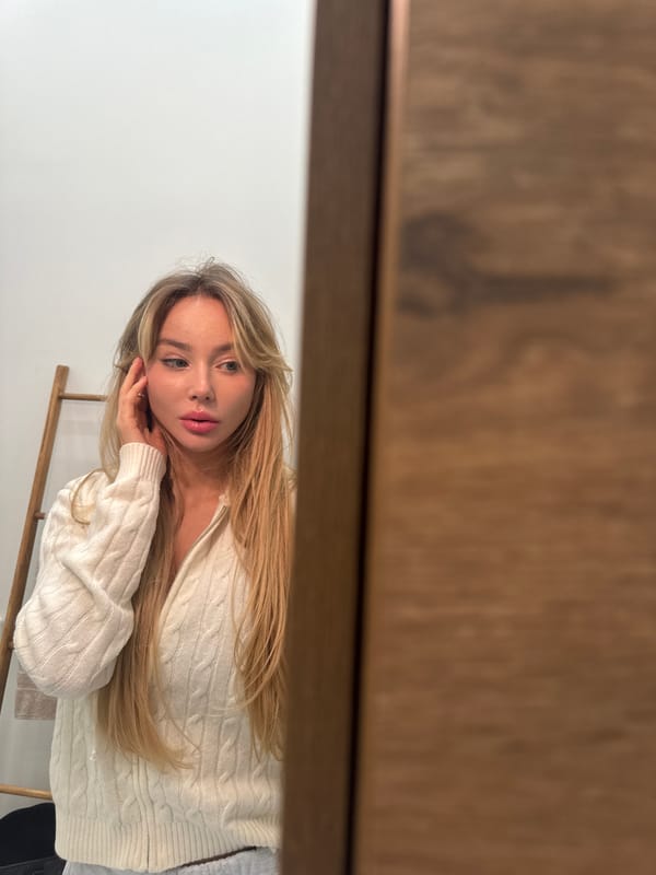 Woman photographed on blue bedding in Moscow apartment