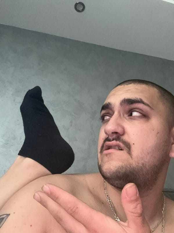 Men take selfies indoors in Pernik, Bulgaria