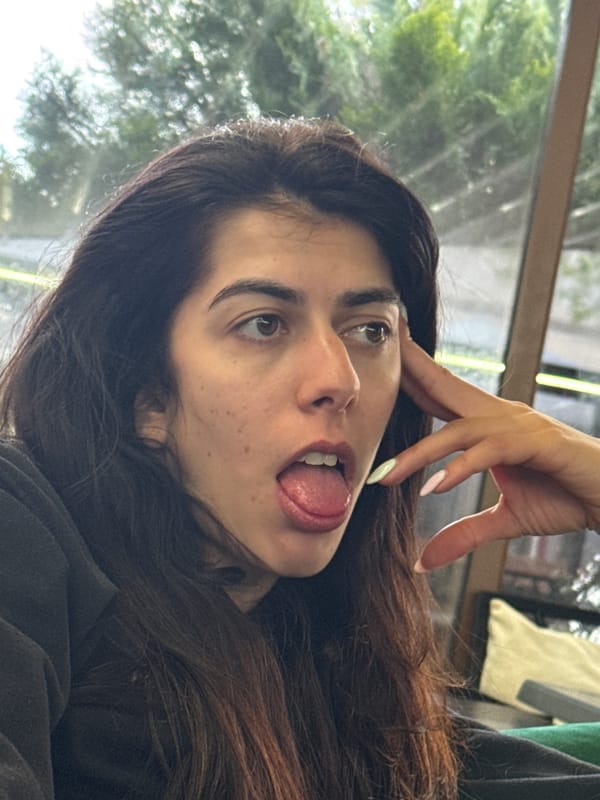 Woman makes playful tongue gesture in Kazanlak, Bulgaria