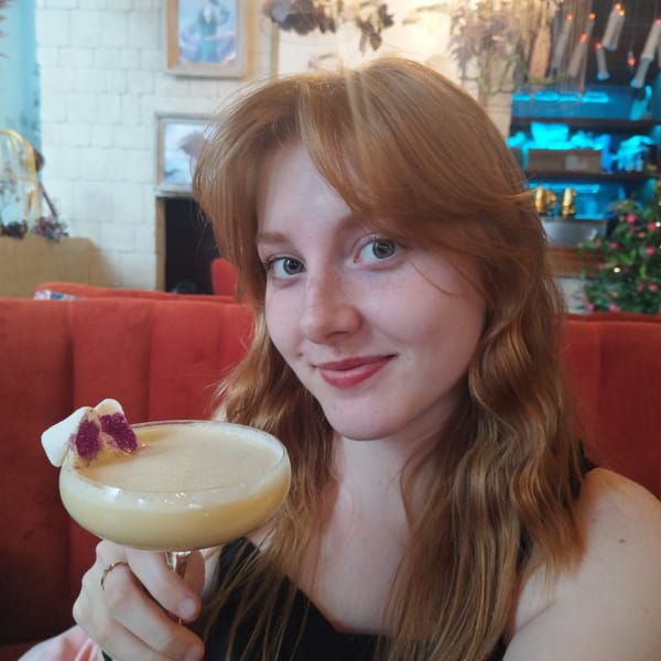 Social gathering with drinks and candles documented in Yekaterinburg