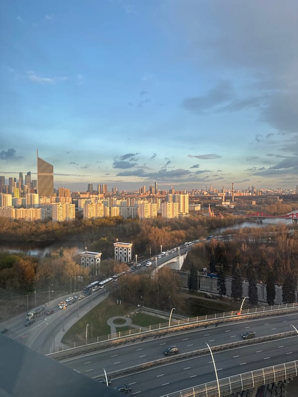 Person documents cityscape views with smartphone in Khimki