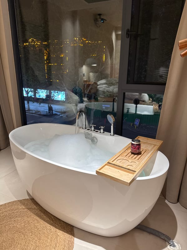 Rose petal bath preparation captured in Wulingyuan apartment