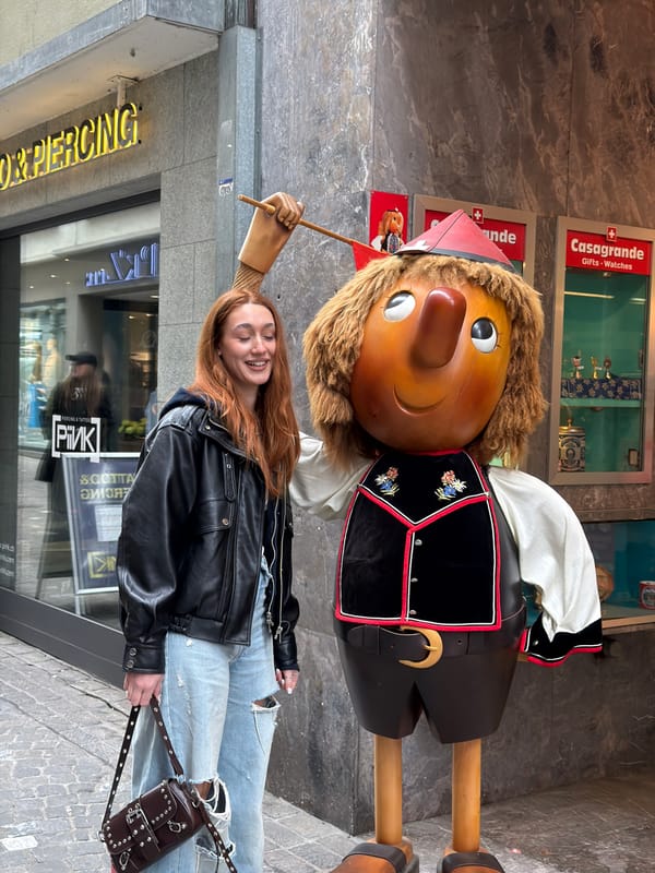 Tourist documents afternoon walking tour through historic Lucerne city center