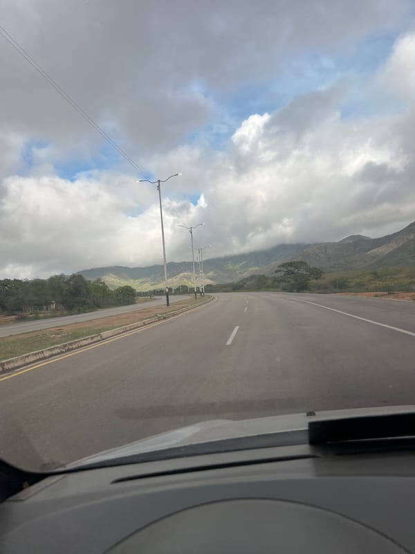 Driving through Santa Ana's highway with mountains ahead