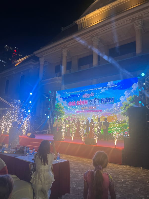 Outdoor Vietnamese cultural stage show with dancers and LED displays