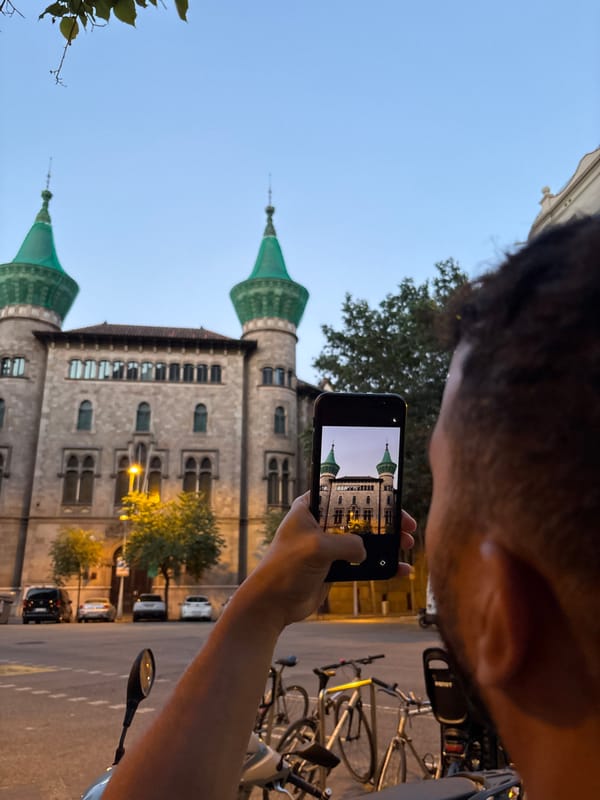 Barcelona's ornate streets at dusk, bars and architecture