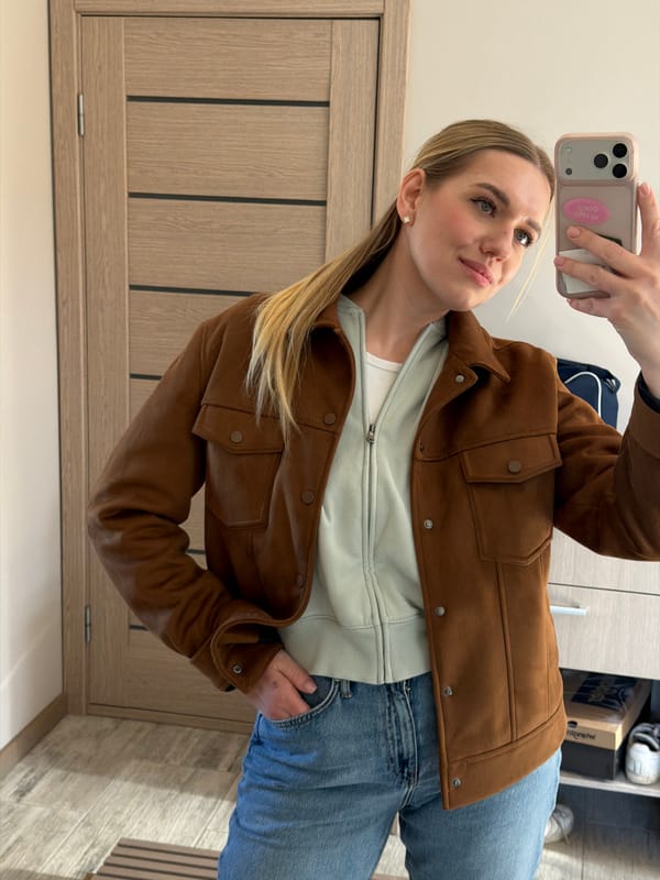 Woman takes mirror selfie in Dreiliņi, Latvia