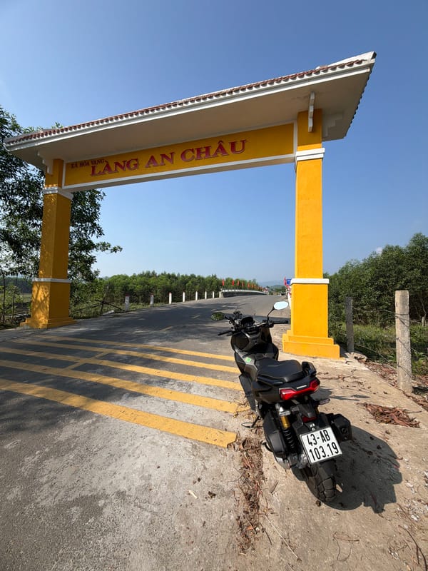 Motorcycle parked at An Châu village monument in Đà Nẵng