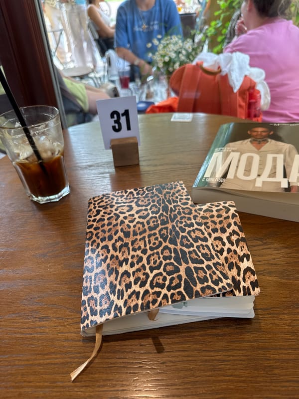Lazy café afternoon in Saint Petersburg with books, coffee, and a dog