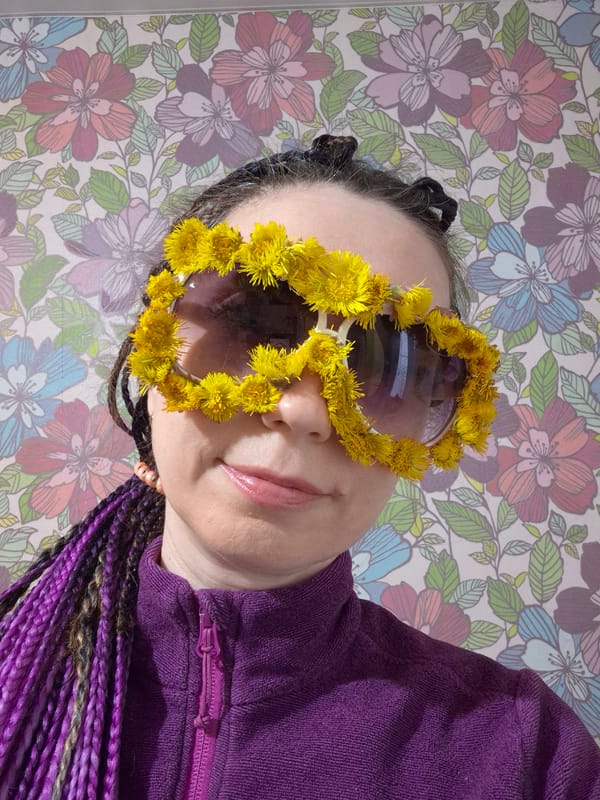 Person with colorful braids photographed in casual portrait session