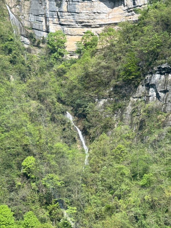 Cable car passenger photographs mountain scenery in Yongding District