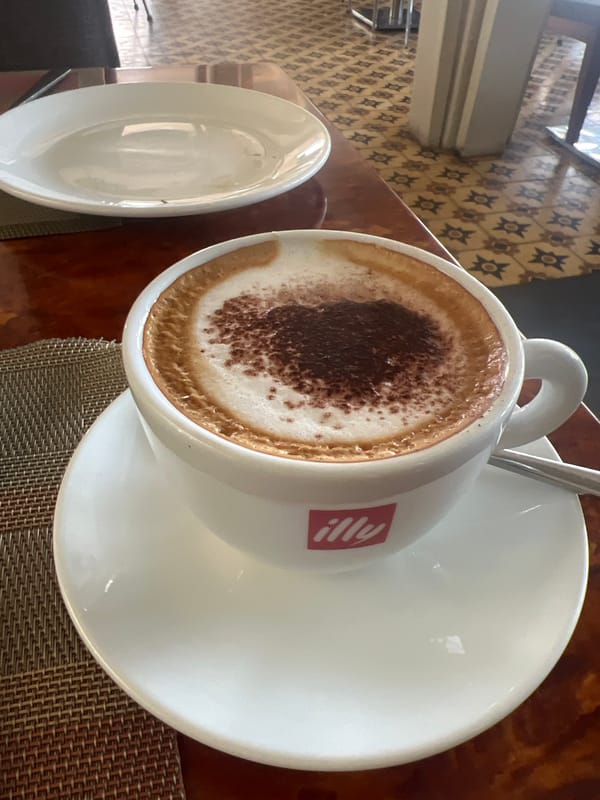 Tourist documents breakfast spread at Siem Reap restaurant