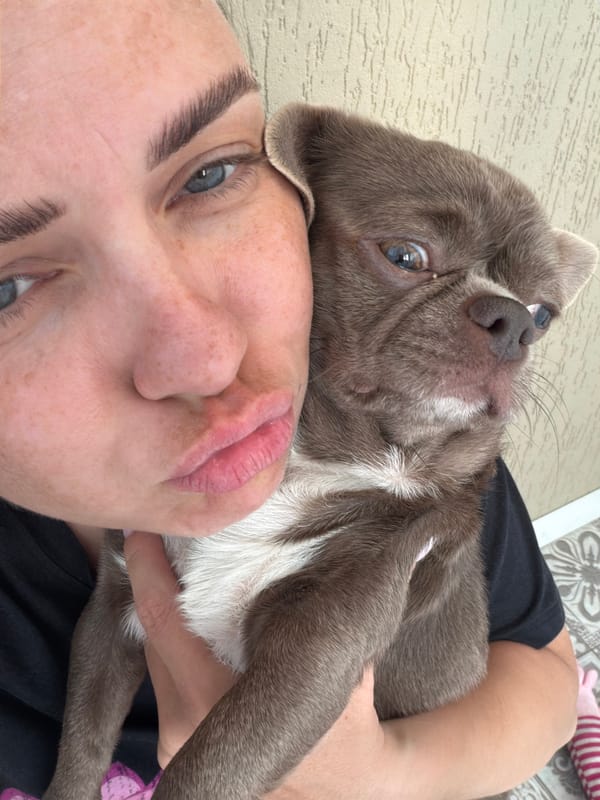 Woman and pet dog share quiet afternoon moments in Votkinsk