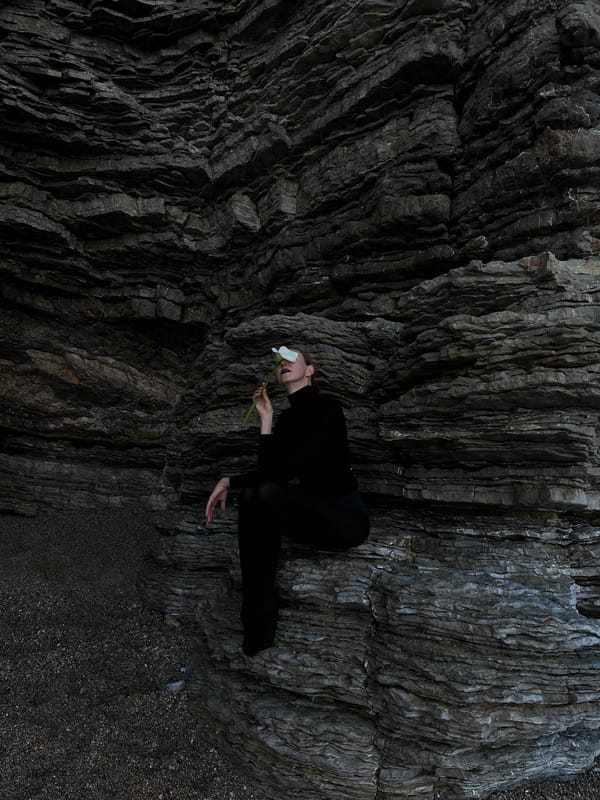 Artistic portrait session with white flower in Montenegro rocks