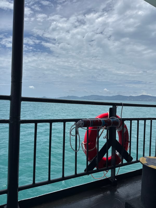 Ferry deck life preserver, calm turquoise waters off Ko Pha-ngan