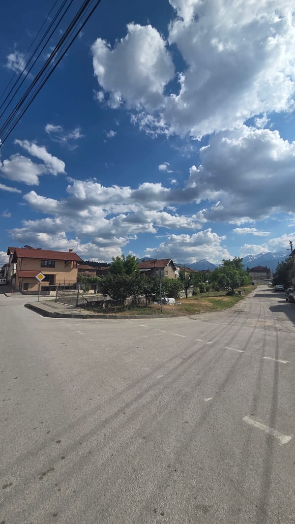 Streets, a stone church, and a stork's nest in Bania