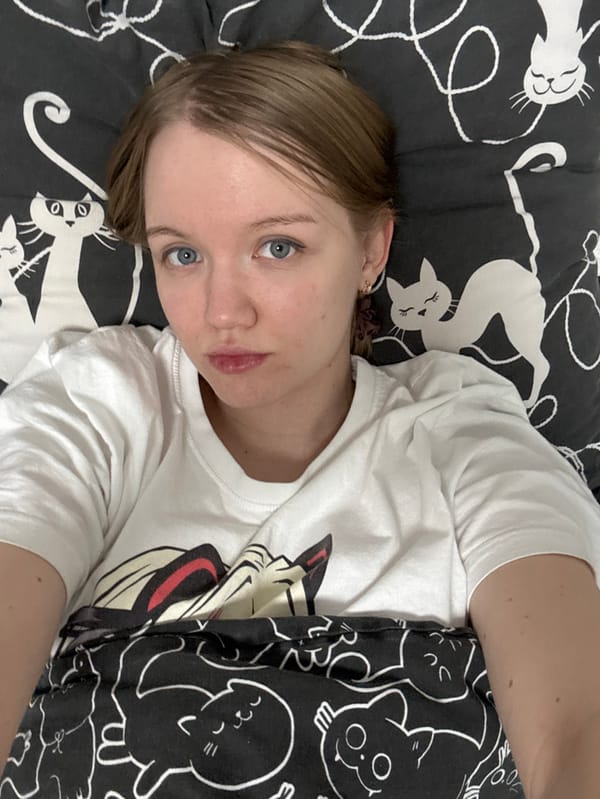 Woman documents burger meal with selfies in Nizhnekamsk bedroom