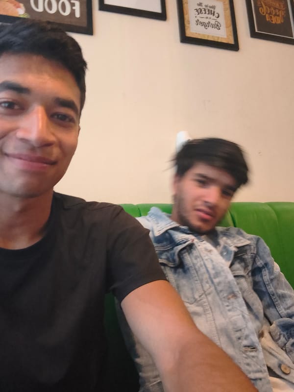 Cafe hangout with food, phones, and candid group moments