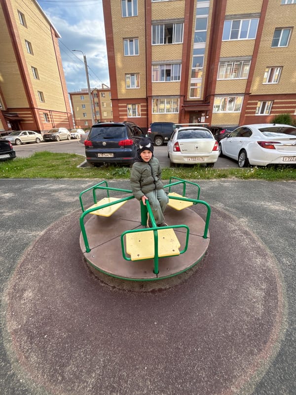 Child plays on carousel at Yaroslavl playground