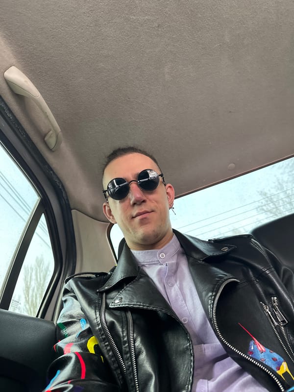 Person photographed in car wearing artistic leather jacket, Saratov