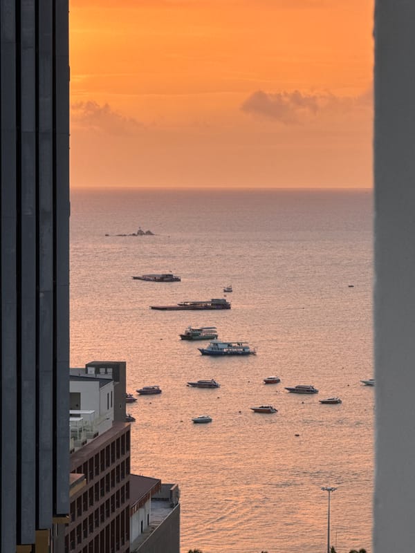 Aerial sunset views over Pattaya's coast and cityscape
